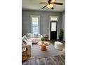 Cozy living room setup with a white sectional sofa, a stylish rug, and contemporary decor at 179 E Pearl St, Greenwood, IN 46143