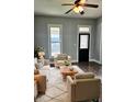Cozy living room with comfortable seating, area rug, and view of front door with stained glass window at 179 E Pearl St, Greenwood, IN 46143