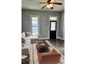 Cozy living room features stylish furnishings and a view of the outside through a bright window at 179 E Pearl St, Greenwood, IN 46143