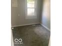 Cozy bedroom with carpet and a window at 1820 S M St, Elwood, IN 46036