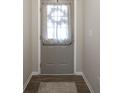 Interior door with window and curtain in the mud room at 19144 Goins Blvd, Westfield, IN 46074