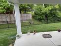 Picture of a cozy patio with a lush green backyard area and privacy fence, perfect for outdoor enjoyment at 200 Mission Terrace Dr, Whiteland, IN 46184