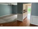 Open-concept space with living room and adjacent kitchen, showcasing the home's layout at 213 Golf Ct, Greenwood, IN 46143