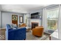 Cozy living room with a fireplace and comfortable seating at 2521 Mcleay Dr, Indianapolis, IN 46220