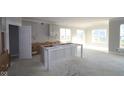 Unfinished spacious kitchen area featuring large windows and an island with white accents at 4290 Ironclad Dr, Bargersville, IN 46106