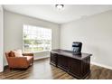 Comfortable office with large desk, leather chair, and a window with natural light at 4602 Hayward Way, Westfield, IN 46062