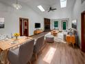 Bright living room with skylights, a fireplace, and an open floor plan at 4825 May Ridge Ln, Indianapolis, IN 46254