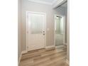 Home entryway featuring hardwood floors and neutral paint at 5196 Canberra Ct, McCordsville, IN 46055