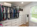 Spacious walk-in closet with custom shelves, drawers, and ample storage at 713 Colonial Way, Greenwood, IN 46142