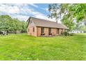 Beautiful exterior showing the house from the side angle and the well-maintained lawn at 7633 Janean Dr, Brownsburg, IN 46112