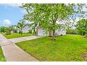 Inviting home with a brick facade, two-car garage, lush green lawn, and sidewalk at 8684 Captain Dr, Avon, IN 46123