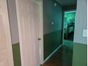 Hallway featuring two-tone walls and doors leading to other rooms at 8810 Summer Walk E Dr, Indianapolis, IN 46227