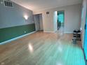 Spacious living room with hardwood floors and neutral paint, offering ample natural light at 8810 Summer Walk E Dr, Indianapolis, IN 46227