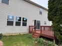 Backyard with a wood deck that has access via a sliding glass door at 8939 Newchurch Blvd, Indianapolis, IN 46231