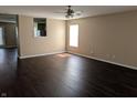 Spacious living room featuring dark hardwood floors and lots of natural light at 901 Westpointe Dr, Shelbyville, IN 46176