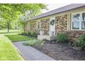 Lovely single-Gathering home with well maintained landscaping and brick walkway at 9390 N State Road 39, Lizton, IN 46149
