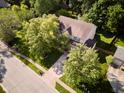 Aerial view of a home showcasing its mature trees, and well-maintained neighborhood at 9705 Valley Springs Blvd, Fishers, IN 46037