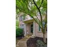 Inviting front exterior with covered porch, manicured lawn, and beautiful landscaping at 9705 Valley Springs Blvd, Fishers, IN 46037
