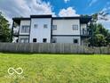 Modern home with a spacious yard and fenced perimeter at 1001 Harlan St, Indianapolis, IN 46203