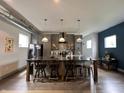 Modern kitchen featuring gray cabinets, an island with seating, and stainless steel appliances at 1001 Harlan St, Indianapolis, IN 46203