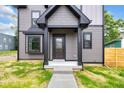 Inviting entryway with a stylish door and modern house number, creating a great first impression at 1027 Hosbrook St, Indianapolis, IN 46203