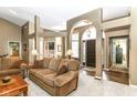 Spacious living room showcasing an open floor plan, neutral decor, and ample natural light at 10759 Sawgrass Dr, Fishers, IN 46037
