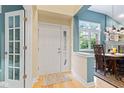 Welcoming foyer with hardwood floors and a view of the dining area at 11510 Monon Farms Ln, Carmel, IN 46032