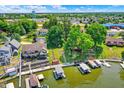 Picturesque lakefront homes with private docks, multi-level decks and lush greenery at 1240 Stringtown Pike, Cicero, IN 46034