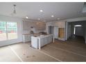 Unfinished kitchen featuring a large island, recessed lighting, and ample cabinet space at 12403 Fresh Stock Dr, Noblesville, IN 46060