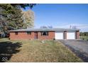 Well-maintained brick home with an attached two-car garage and mature lawn at 13518 (3 Lots) Promise Rd, Fishers, IN 46038