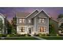 Beautiful two-story home with gray siding, black trim windows, and professionally landscaped front yard at 15360 Cardonia Rd, Fishers, IN 46037