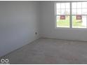 Bright, unfinished room features a large window offering ample natural light and exterior views at 16823 Cheddar Dr, Noblesville, IN 46060