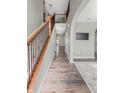 Inviting entryway featuring hardwood floors, wrought iron staircase, and arched doorways at 1843 Winchester Blvd, Avon, IN 46123