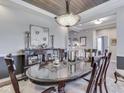 Elegant dining room featuring stylish lighting, dark wood floors, and a decorative sideboard at 187 N Bend Dr, Greenwood, IN 46142