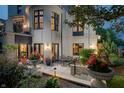 Outdoor patio with elegant table and chairs, surrounded by lush greenery and flowerpots at 1894 Rhettsbury St, Carmel, IN 46032
