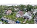 Charming home nestled in a quiet neighborhood with well-manicured lawns at 1947 N Parker Ave, Indianapolis, IN 46218
