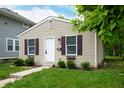 Well-maintained single-Gathering home with siding, shutters, and landscaped front yard at 2402 Adams St, Indianapolis, IN 46218
