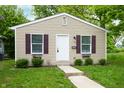 Inviting single-story home with shutters, garden boxes, and tidy landscaping at 2402 Adams St, Indianapolis, IN 46218
