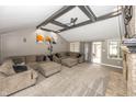Cozy living room with a brick fireplace, ceiling fan and comfortable seating at 28 Patriot Ct, Greenfield, IN 46140