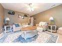 Cozy living room featuring a neutral color palette, comfortable seating, and stylish decor at 2875 Prairie Stream Way, Columbus, IN 47203