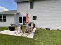 Outdoor patio area with table, umbrella, chairs, and grill is perfect for entertaining at 425 Bridgewater S Ln, Muncie, IN 47304