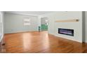 Bright living room with hardwood floors and modern fireplace, creating a welcoming ambiance at 5160 N High School Rd, Indianapolis, IN 46254