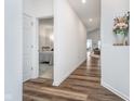 Bright hallway with wood floors leading to the bedroom and living area at 5304 Maywood Dr, Whitestown, IN 46075