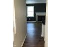 A living room with a fireplace and dark hardwood flooring creating a cozy ambiance at 6070 Southbay Dr, Indianapolis, IN 46250