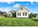 Charming two-story home with manicured lawn, white painted brick, stone accents and beautiful landscaping at 6672 Braemar S Ave, Noblesville, IN 46062