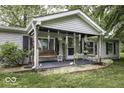 Cozy front porch features a swing and seating area at 6691 S County Road 350 W, Clayton, IN 46118