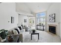 Bright living room with fireplace, vaulted ceilings, and modern furnishings at 7510 Harbour, Indianapolis, IN 46240