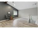 Bright living room with hardwood floors, vaulted ceilings and ample natural light at 7940 Sunfield Ct, Indianapolis, IN 46214