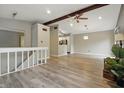 Open living area featuring hardwood floors, ceiling fan, and recessed lighting at 7940 Sunfield Ct, Indianapolis, IN 46214