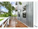 Private balcony with wood decking and modern railing, perfect for enjoying outdoor views at 902 Woodlawn Ave, Indianapolis, IN 46203